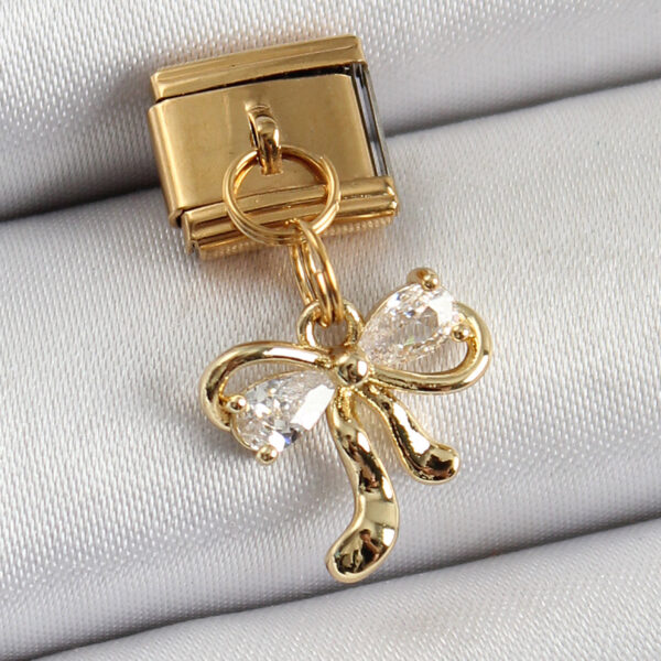 Çelik Sallantılı Zirkon Taşlı Fiyonk Model Gold Renk Nomination Charm